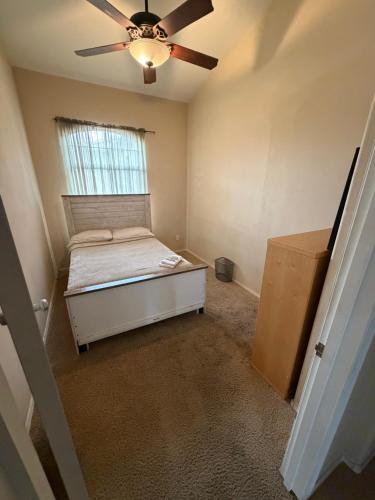 a bedroom with a bed and a ceiling fan at Goodyear Cul-de-sac Room 6 in Goodyear