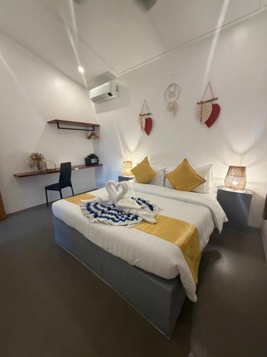 a bedroom with a large bed in a room at RVilla El Nido in El Nido