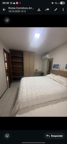 a picture of a bedroom with a large bed at Mom Blanc Flat Service in São Luís