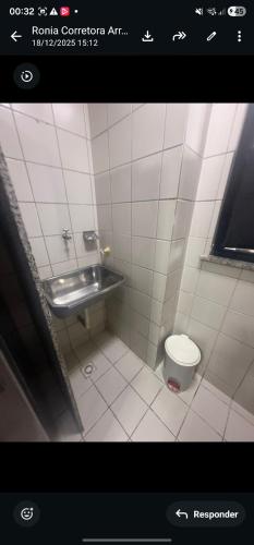 a bathroom with a toilet and a sink at Mom Blanc Flat Service in São Luís