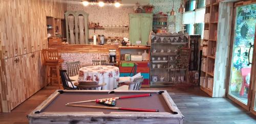 a room with a pool table in a room with a table at Jarasum guesthouse in Kap'yŏng-yŏk