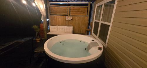 a large bath tub in a room with at Cozy Basement Suite in Lower Sackville