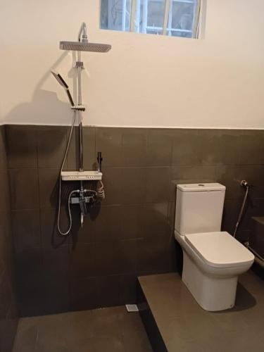 a bathroom with a toilet and a sink at Ven OCEAN VIEW in Grand-Baie