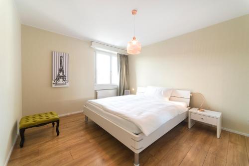 Ein Bett oder Betten in einem Zimmer der Unterkunft RELOC Serviced Apartments Wallisellen Bhf.