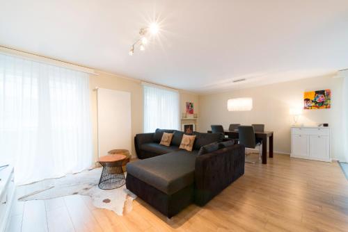 Гостиная зона в RELOC Serviced Apartments Wallisellen Bhf.