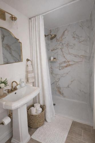 a white bathroom with a sink and a shower at Sullivan Heritage 1847 - Queen Room Private Bathroom in A Private Home in Boston