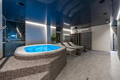 a large bathroom with a jacuzzi tub at Grand Baltic Dunes Hotel & SPA in Palanga