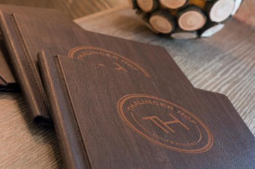 a brown book sitting on top of a table at Thalinger Hof in Kronstorf