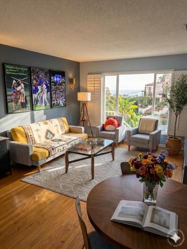 a living room with a couch and a table at Spacious 3BR Luxury Villa Gated Parking Near Dodger St DTLA in Los Angeles