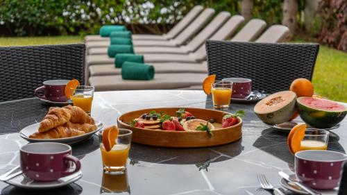 a table with a tray of food on a table at Villa Vitoria - by LovelyStay in Funchal