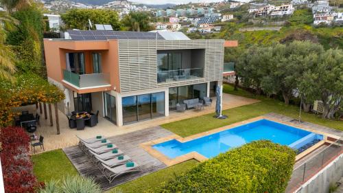 an aerial view of a house with a swimming pool at Villa Vitoria - by LovelyStay in Funchal
