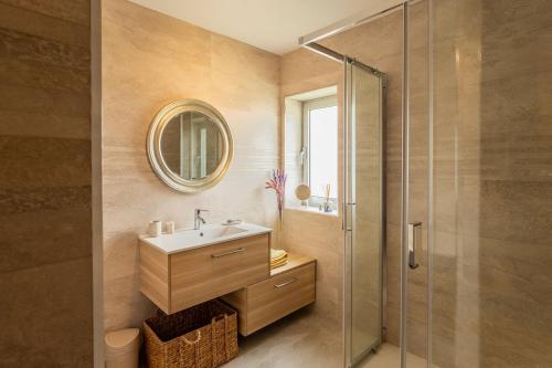 a bathroom with a sink and a shower at Mirador House in Vila Garcia