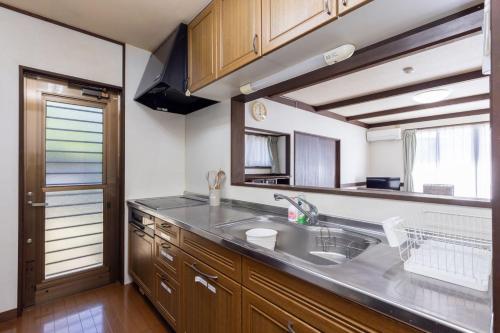 a kitchen with a sink and a counter top at Irest Village Matsumoto 2 in Matsumoto