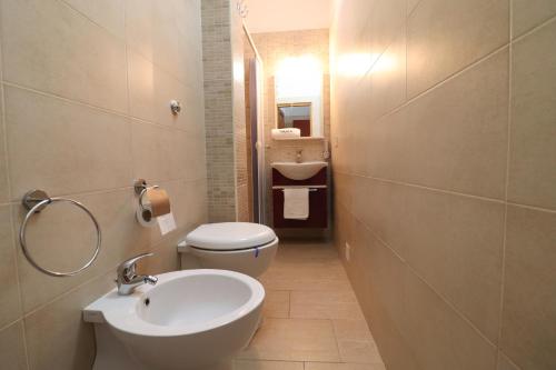 a small bathroom with a toilet and a sink at Kyma's House in Otranto in Otranto