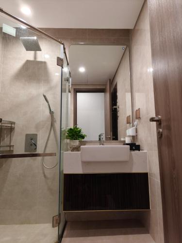 a bathroom with a sink and a shower at Chill House in Hai Phong