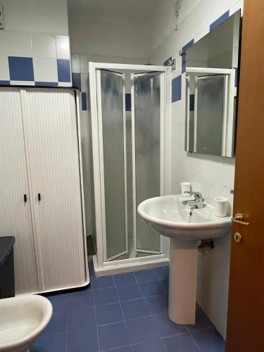 a bathroom with a sink and a shower at Marina Fiorita in Grado