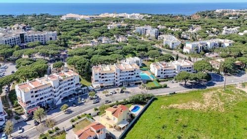 an aerial view of a city with buildings and the ocean at Villa Orange with private pool Albufeira in Albufeira