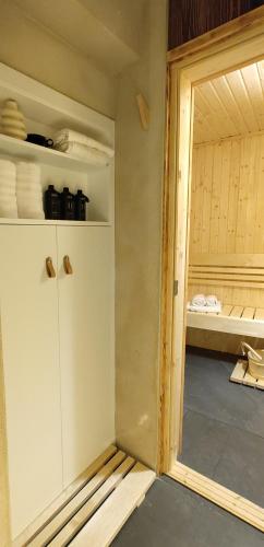a room with a closet with a door open at MALU' Exclusive Retreat in Pescocostanzo