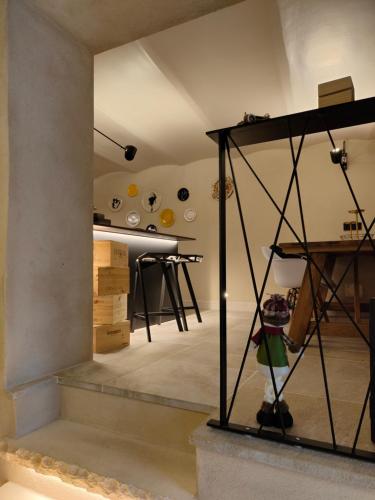 a room with desks and tables in a room at MALU' Exclusive Retreat in Pescocostanzo