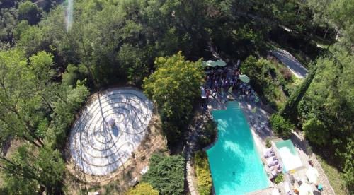 an aerial view of a spiral swimming pool with trees at Château de Madières - Châteauzen in Rogues