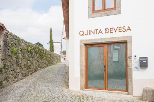 a building with a door on the side of a street at GuestReady - Quinta da Devesa in Vila Nova de Gaia