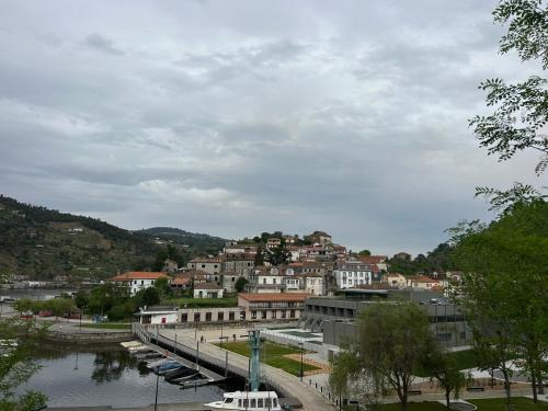 a city with boats docked in a body of water at Chalé Caldas de Aregos in Caldas de Aregos