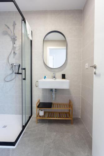 a bathroom with a sink and a mirror at AT Ponent II B3 in Oliva