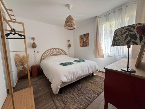 Foto Bas de villa et jardin privatifs - à 10 mins à pieds des plages & parking - Les Bambous 2