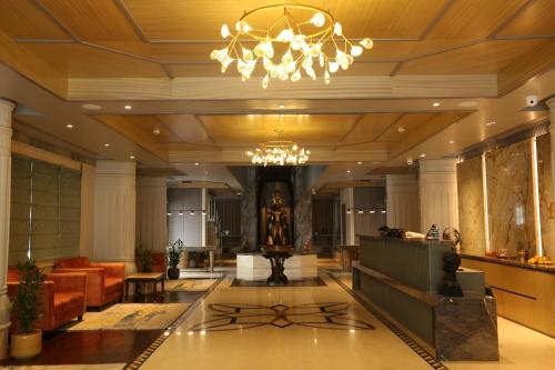 a lobby of a hotel with a chandelier at PRAGATI MANOR in Guwahati