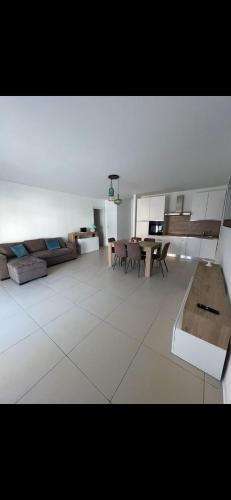 a living room with a couch and a table at MaVi Apartament in Castel di Sangro