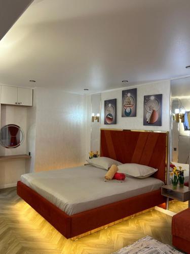 a bedroom with a large bed in a room at Korkyt in Qyzylorda
