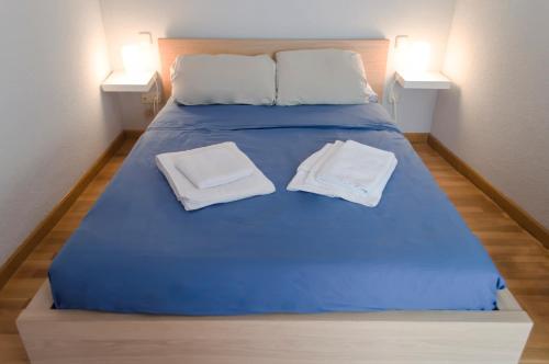 Postel nebo postele na pokoji v ubytování For You Rentals reina sofia apartment TEMPORAL DF21