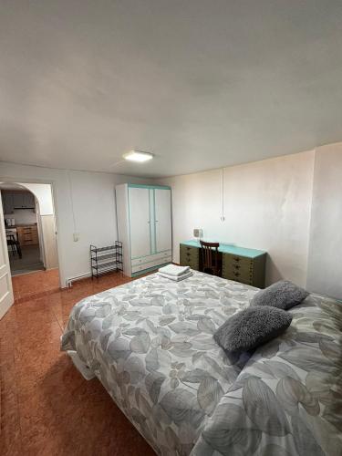 a bedroom with a large bed with pillows on it at Casa Rural SERAGAL in El Bonillo