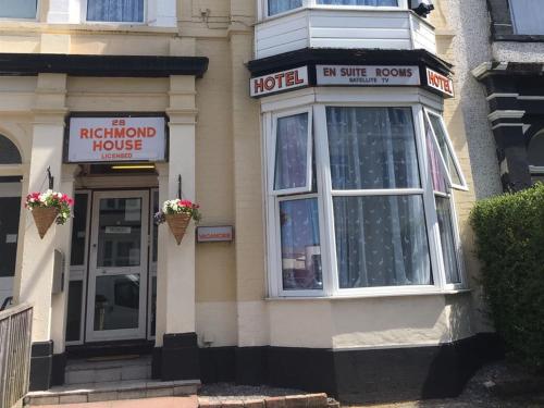 a hotel building with a hotel sign on it at Richmond House Hotel in Southport