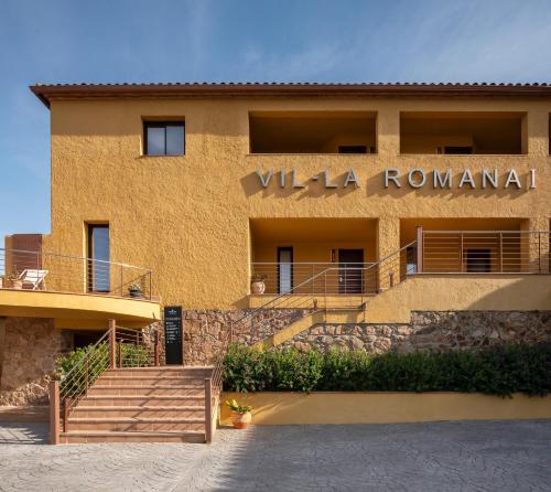 a building with a sign that reads villa roma at Feelathome Vil-la Romana in Tossa de Mar