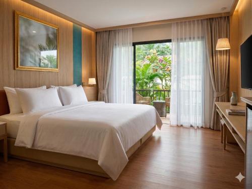 a bedroom with a large bed and a large window at Simple Life Resort Koh Tao in Ko Tao