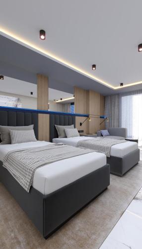 a room with three beds in a room at Almaris Resort Hotel - Ultra All Inclusive in Alanya