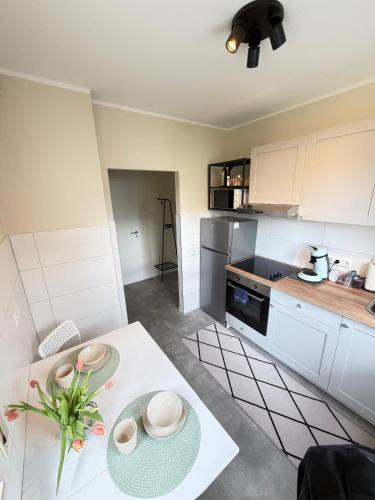 a kitchen with a table with plates on it at K10 Living in Karlsruhe