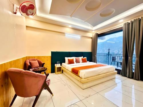 a bedroom with a bed and a balcony at The Pranav Retreat A Premium Property in Nainital