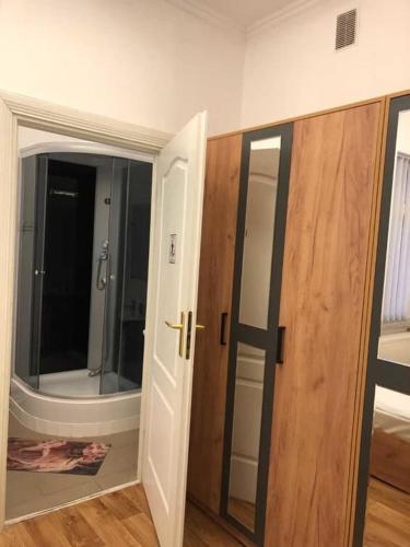 an empty room with two doors and a mirror at Міні Готель Особняк in Lviv