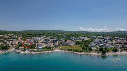 an aerial view of a resort on the water at Luxury Apartments Villa Luce in Malinska