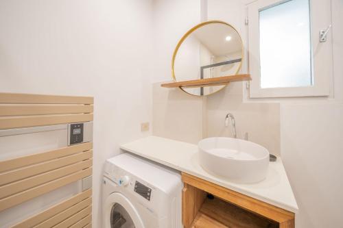 a bathroom with a sink and a washing machine at 6P apartment in a Citadelle with POOL - Saint-Tropez in Saint-Tropez