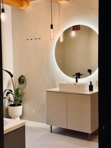 a bathroom with a sink and a mirror at Silarozes in Mālpils