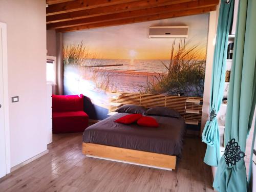 a bedroom with a bed with a painting on the wall at Note di lago in Manerba del Garda