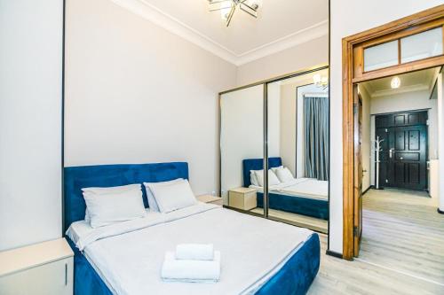 Postel nebo postele na pokoji v ubytování WAFT Apartment