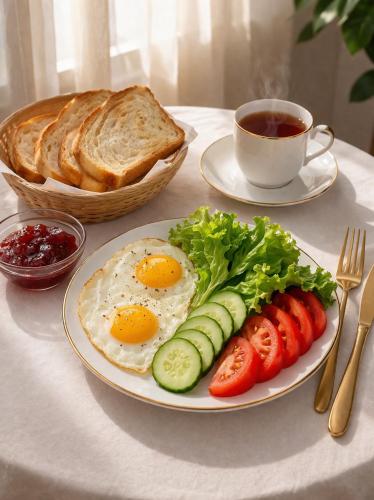 a plate of breakfast food with eggs and bread and a cup of coffee at Mongolian Nomadic Herders in Dörgön