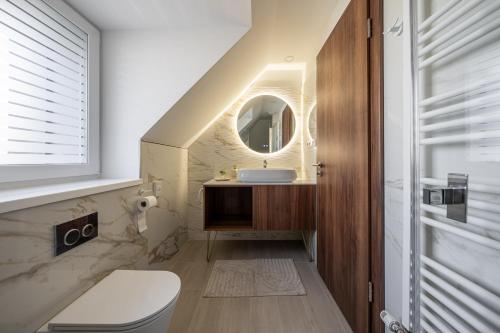 a bathroom with a sink and a mirror at Dolce Vita Hotel Art in Budapest
