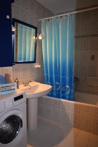 a bathroom with a washing machine and a washer at Traditional Villa Marina in Chios
