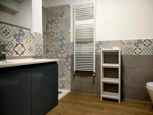 a bathroom with a sink and a toilet at Villa Toti in Montepaone