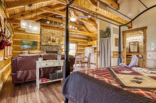 a bedroom with a bed and a living room at Pipers Place in Townsend